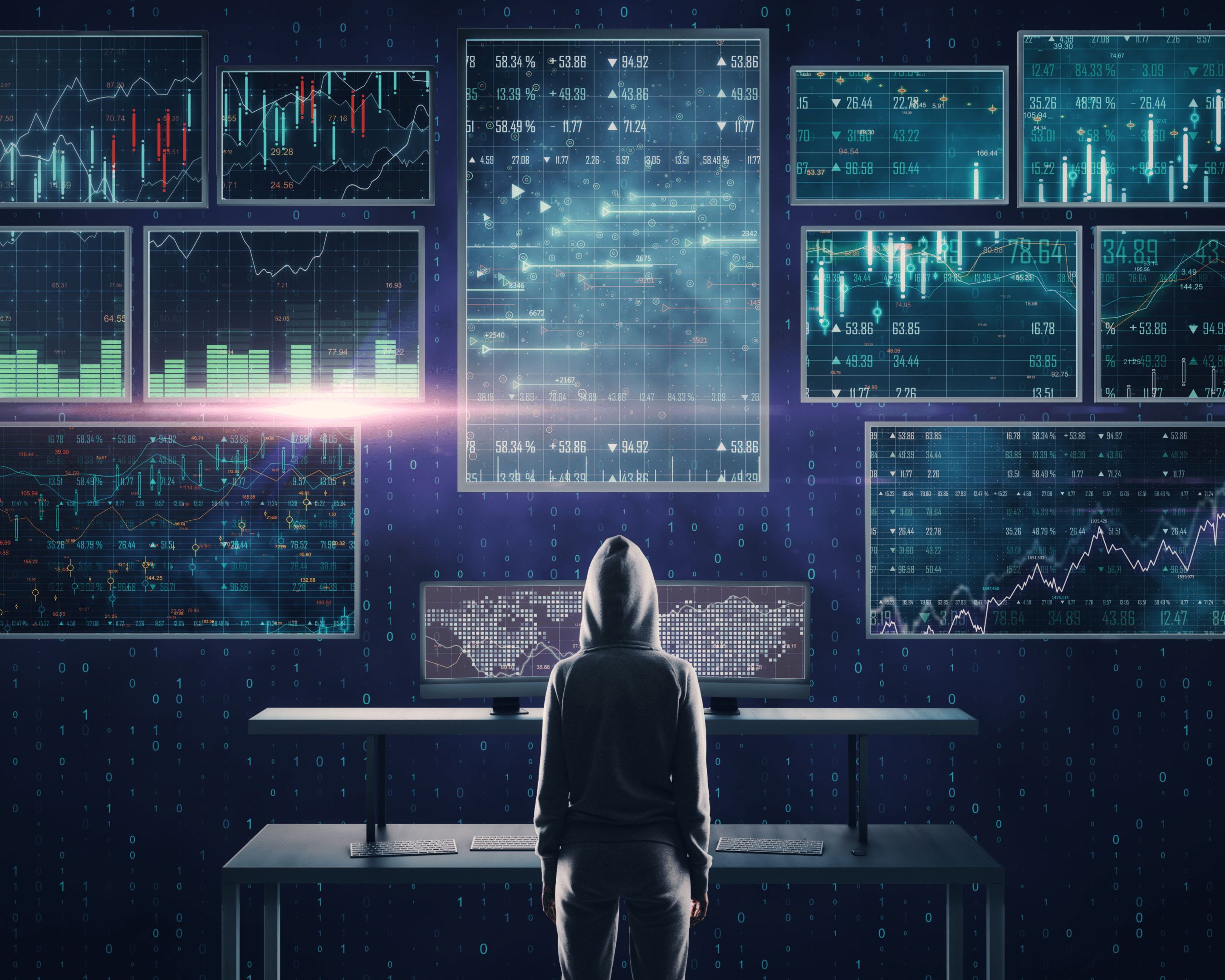 Hacker devant un mur d'écrans d'ordinateurs